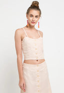 A chic linen singlet top with a button at the front would be a stylish and versatile addition to any wardrobe. Linen fabric provides a lightweight and breathable feel