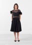 Haut en plumes d'organza