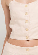 A chic linen singlet top with a button at the front would be a stylish and versatile addition to any wardrobe. Linen fabric provides a lightweight and breathable feel