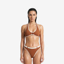 Front view of a model wearing the Ursula 2P brown and ivory bikini set featuring a retro halter top and high-rise belted bottoms.