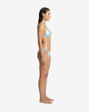 Side profile of the wet-blue glossy bikini showcasing the slim straps and adjustable side-tie closure on the high-cut bottoms.
