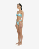 Side profile of the Missy wet-blue bikini showcasing the strapless bandeau design and the curve-hugging fit of the glossy high-leg bottoms.
