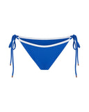 Blue side-tie bikini bottoms with white contrast straps, a trendy women’s beachwear piece for surfing and sunbathing in Bali.