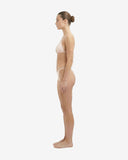 Side profile of the baby pink strapless bikini showcasing the stretchy biflex net fabric and high-cut leg silhouette.