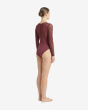 Side profile of the cherry long-sleeve swimsuit highlighting the sheer mesh panels on the shoulders and the protective athletic fit.