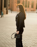 ULUPI Clutch Bag in Black with Woven Leather Details