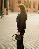 ULUPI Clutch Bag in Black with Woven Leather Details