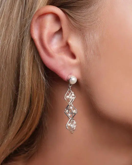White Pearl Statement Drop Earrings detailed with fine artisanal silver, perfect beach-ready accessory