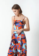  this top offers a flattering and adjustable fit that hugs your curves in all the right places.