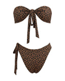 Best Bali swimwear featuring the Les Nenettes leopard-print bikini set with a front-knot bandeau top and matching high-waisted bottoms, ideal for tropical beach styling.
