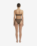 Back view of the leopard-patterned bikini highlighting the bandeau fit and the minimal coverage of the thong style bottoms.