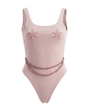 Bali swimsuit brand featuring the Lara pink one-piece with adjustable pearl accents, starfish bust embroidery, and a flattering high-cut silhouette