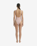 Back view of the pink one-piece swimwear highlighting the scoop back design and high-waisted fit from the Bali collection.