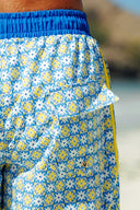 Back detail of the blue and yellow tile print swim shorts showcasing the extra-soft liner and functional pocket construction.