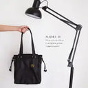 MADRI Bag No. II In Black With Woven Leather Details
