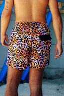 Close-up of the black back pocket on the leopard-print men's swim shorts, showcasing the high-contrast fabric and durable stitching.