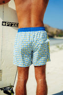Back view of the Lemon Zest shorts highlighting the functional back pocket and the comfortable blue elastic waistband.